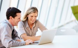 Business people Having Meeting Around Table In Modern Office